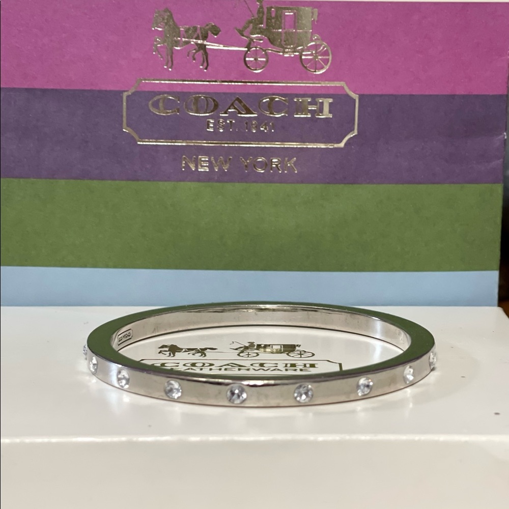 Beautiful COACH silver and crystal bangle.
